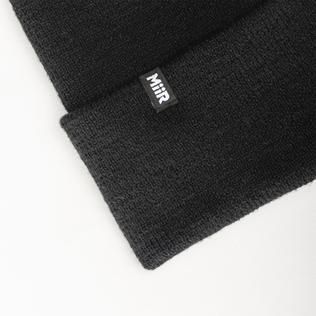 recycled-poly-fine-knit-beanie-k1 WebPDP-RecycledPolyFineKnitBeanie_Studio_TagDetail_Black__BNE005002OS.jpg