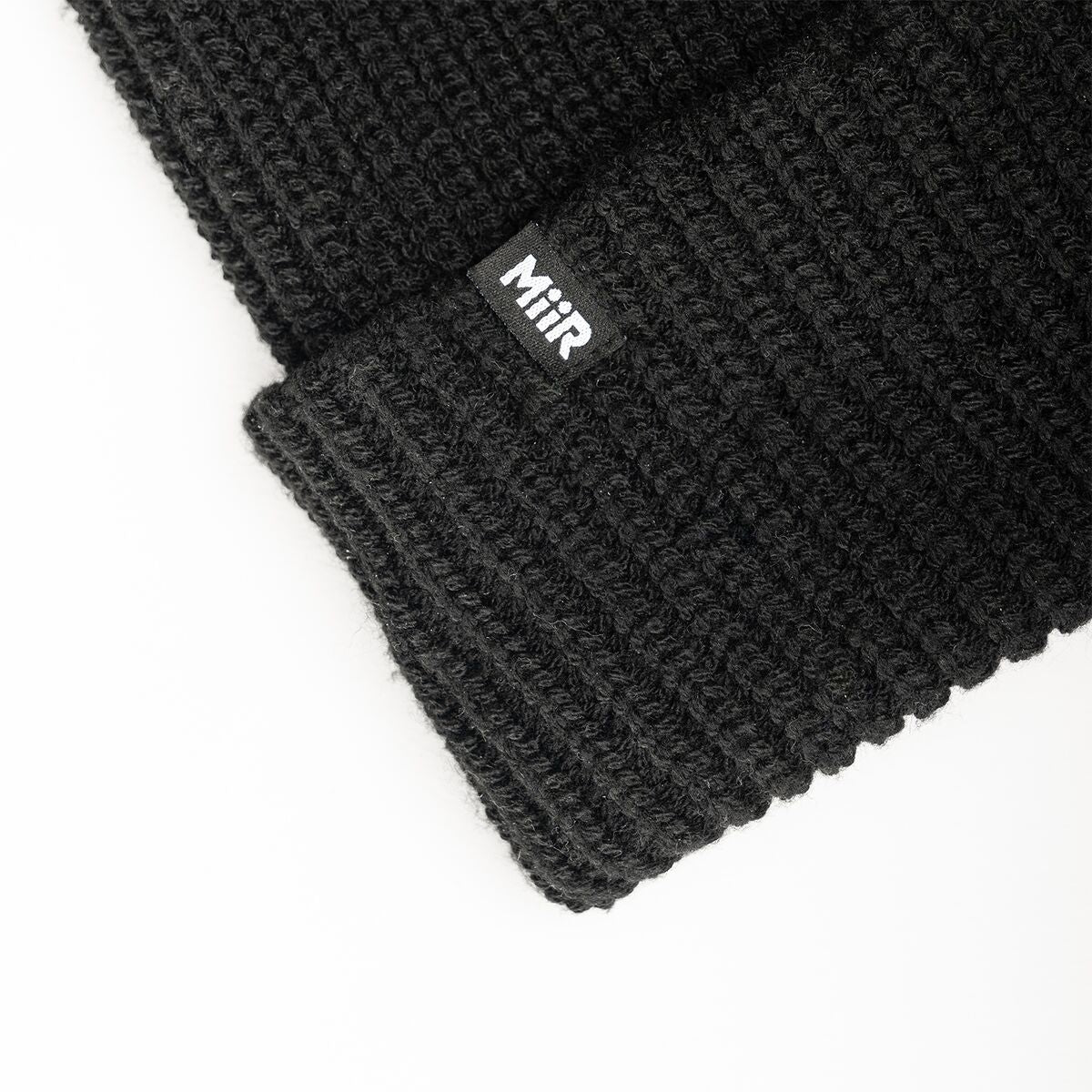 recycled-poly-rib-beanie-w7 WebPDP-RecycledPolyRibBeanie_Studio_TagDetail_Black__BNE002002OS.jpg